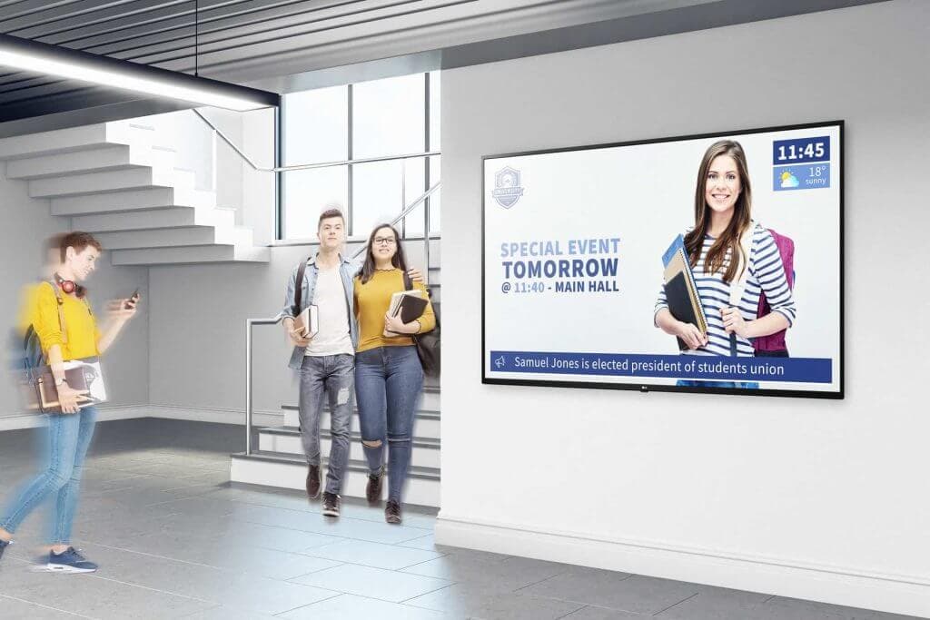 Digital signage in the corridor of a school or college showcasing a special event being held in the main hall on the next day