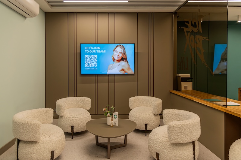 Healthcare waiting room digital signage showing wayfinding and health information